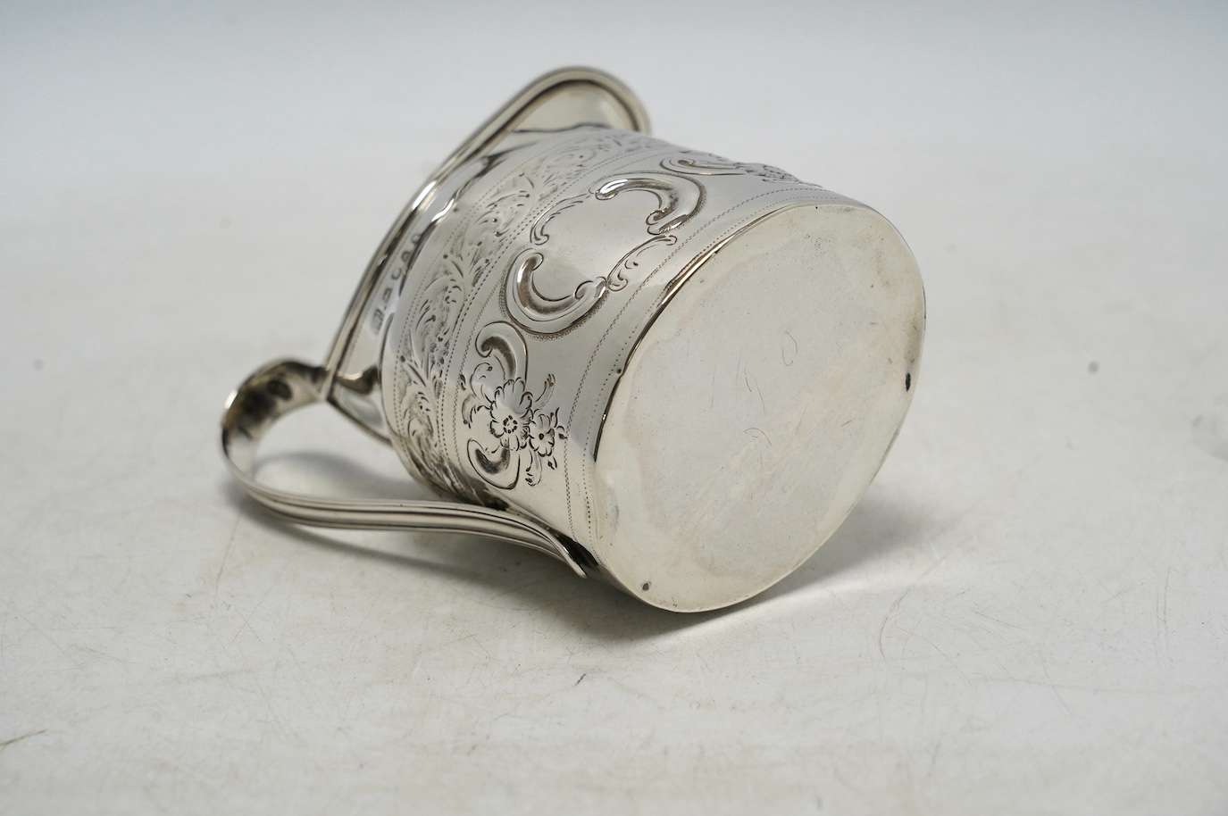 A George III silver cream jug, with later decoration, Robert & David Hennell, London, 1796, 10.4cm, 3.5oz. Condition - poor to fair